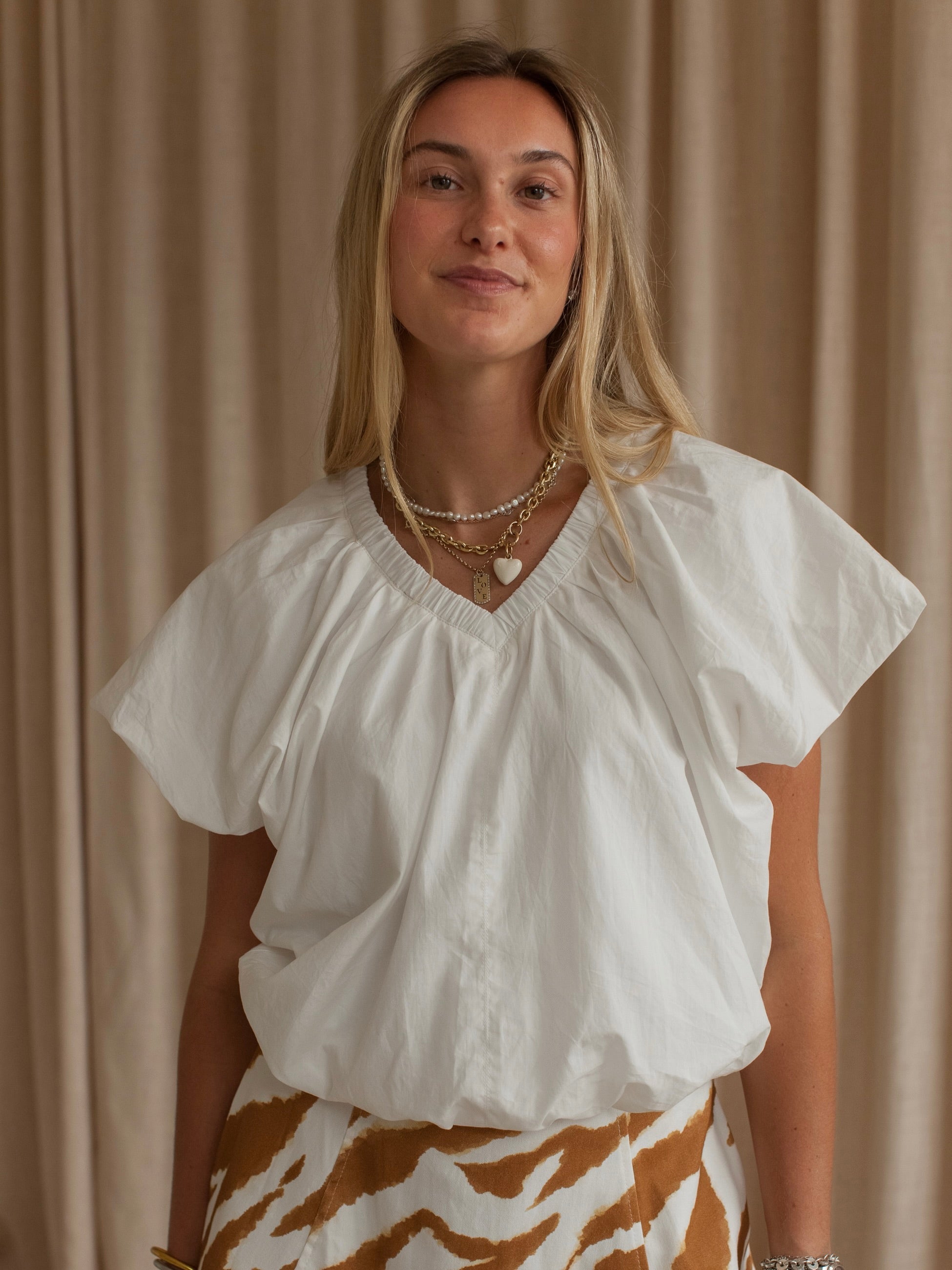 Blusa descontraída de algodão com mangas balão